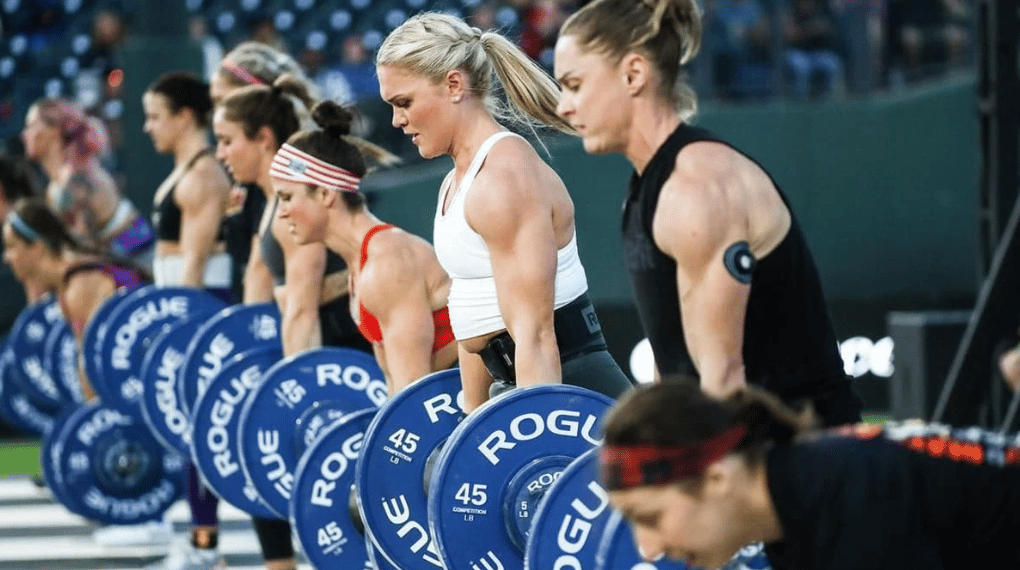 CrossFit athletes lifting loaded barbells