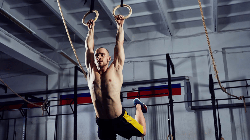 Athlete performs a muscle-up