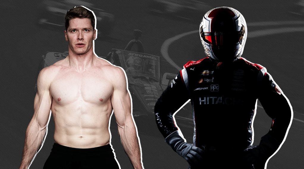 Josef Newgarden standing next to picture of himself in racing suit. 
