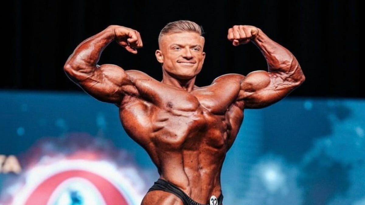 Urs Kalecinski posing 2022 Olympia