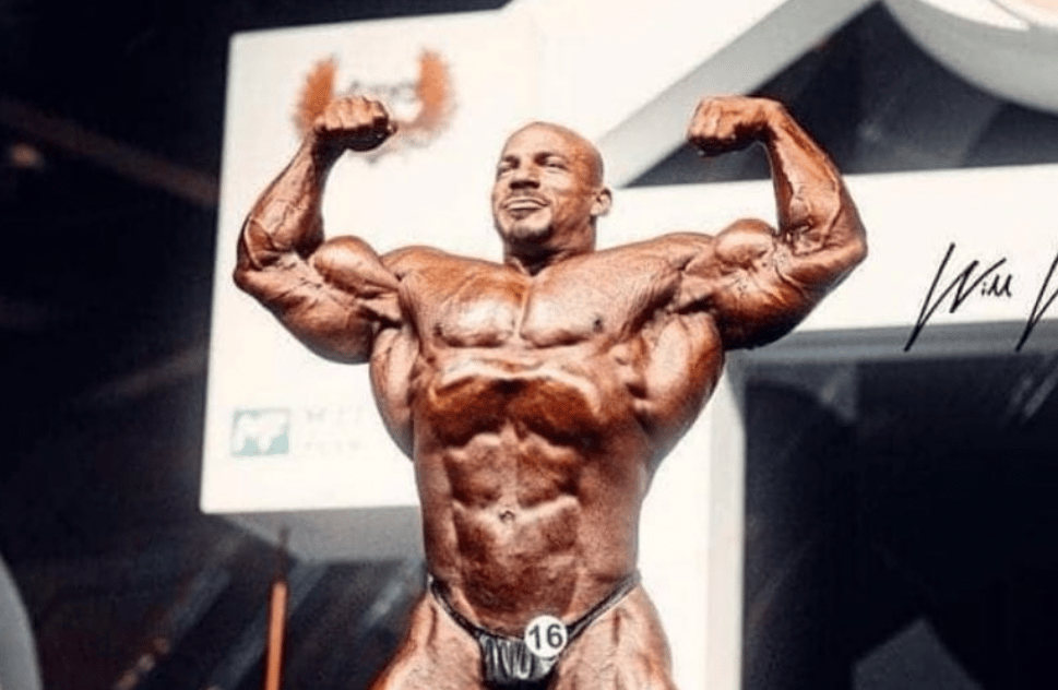 Mamdouh Elssbiay posing at a Mr. Olympia contest