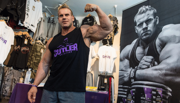 Jay Cutler flexes with one arm
