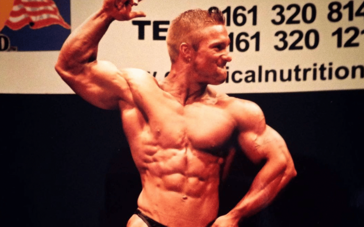 A young Flex Lewis flexes at a competition. 