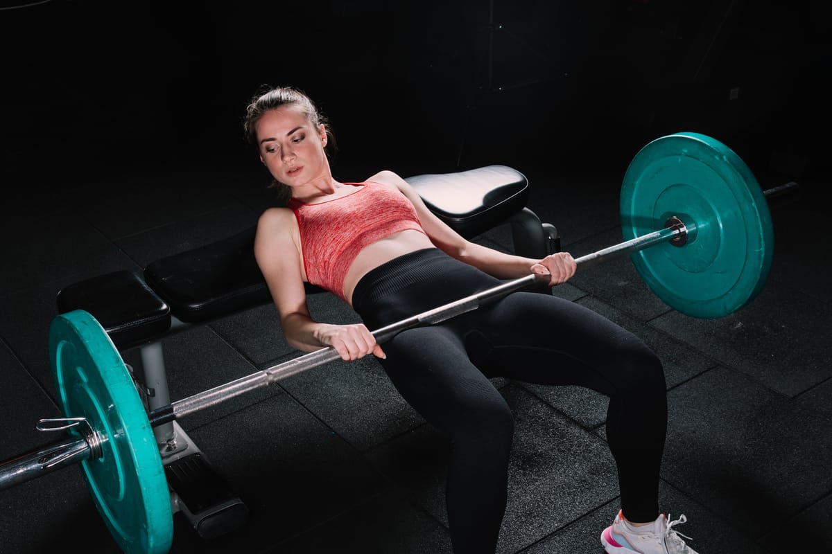 An athlete mid-hip thrust