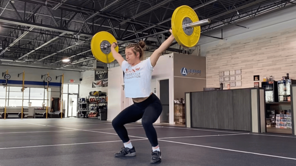 Women performing a snatch movement