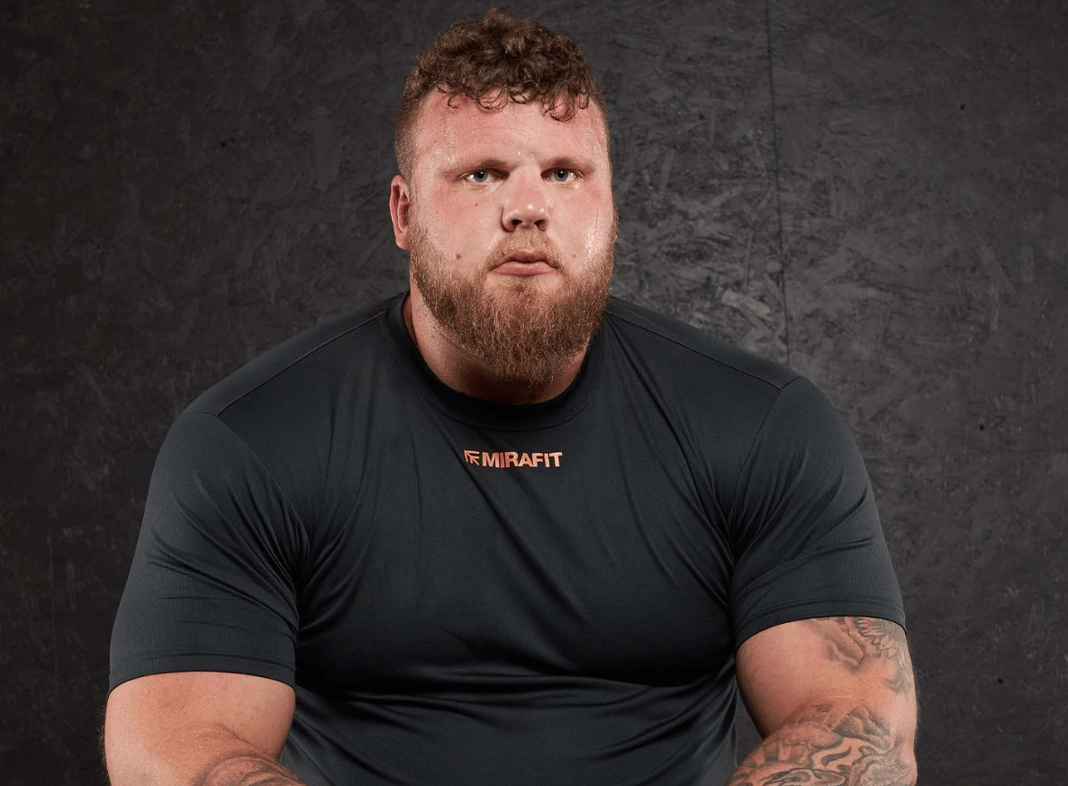 Tom Stoltman competitive face, sitting