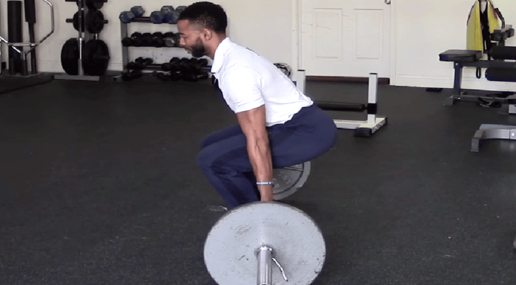 Athlete performs a hack squat