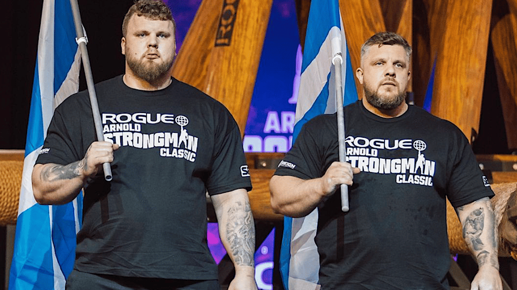 Tom and Luke Stoltman holding flags