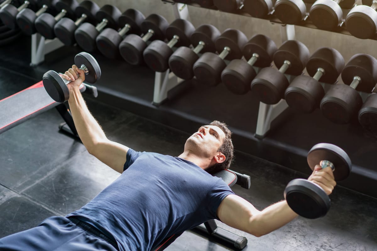 A lifter performs the dumbbell fly