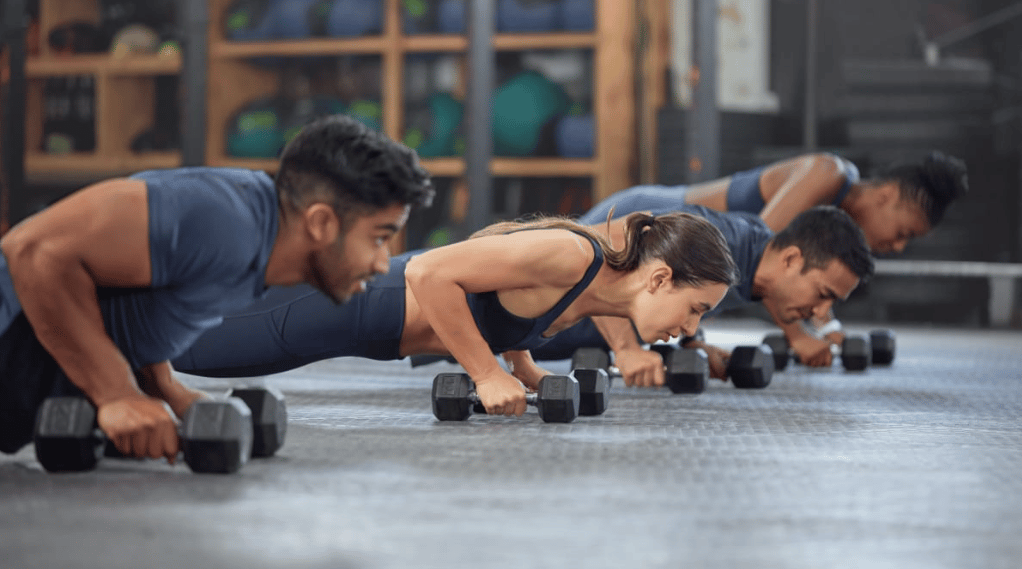 Athletes performing the devil's press
