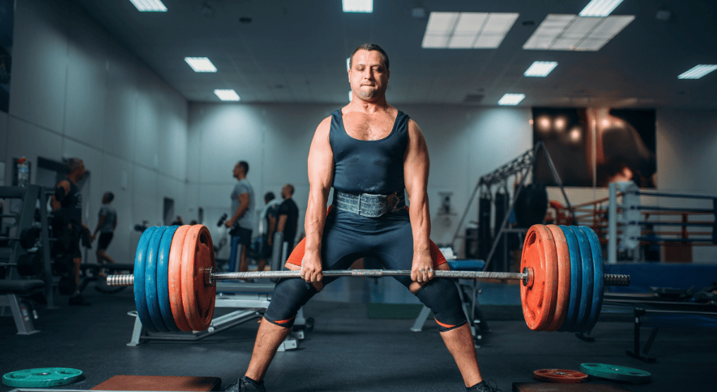 An athlete deadlifts